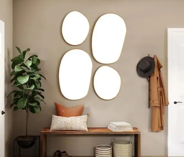 Elegant Curves: Kowtko Oval Metal Wall Mirror for Chic Décor!